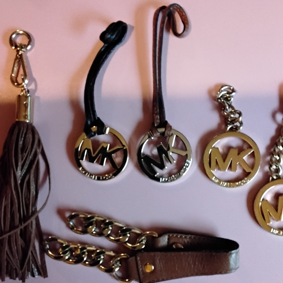 Michael Kors Gold and Brown Medallions. - Picture 1 of 2